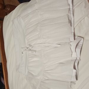 Pirouette Skort - Cool White, lightly stained.